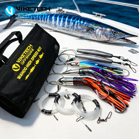 Viketech Wahoo High Speed Kit - three stainless-head trolling lures, two 32 oz trolling weights, shock leaders and roll-up bag beside a wahoo on deck